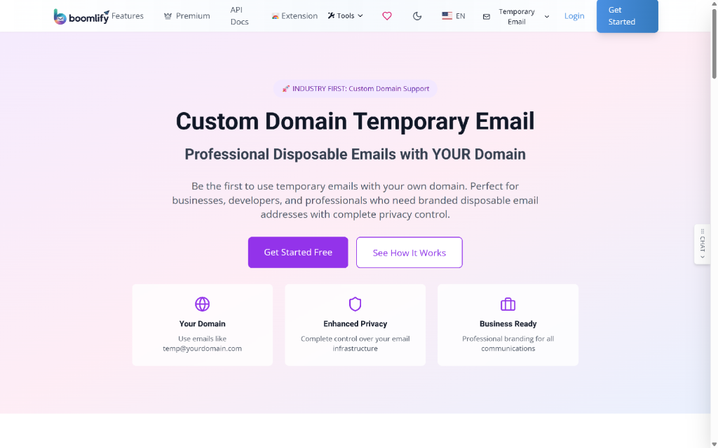 Boomify logo, navigation links for Features, Premium, API Docs, Extension, Tools, heart icon, moon icon, US flag, EN language selector, email icon, Temporary Email dropdown, Login button, and a blue Get Started button. Below is a large heading "Custom Domain Temporary Email" with a subheading "Professional Disposable Emails with YOUR Domain" and descriptive text. Two buttons, "Get Started Free" and "See How It Works", are centered below the text. Three cards are visible: "Your Domain" with a globe icon, "Enhanced Privacy" with a shield icon, and "Business Ready" with a briefcase icon.